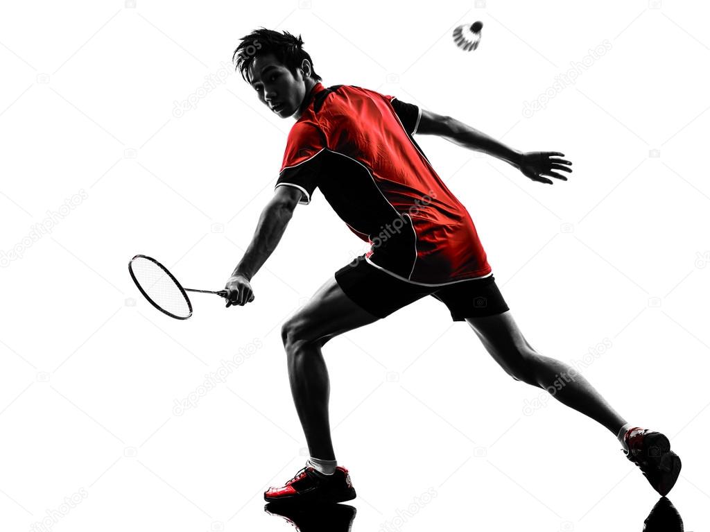One asian badminton player young man in silhouette isolated white background