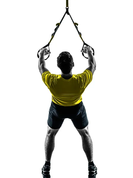 Hombre ejercitando el entrenamiento de suspensión silueta trx — Foto de Stock