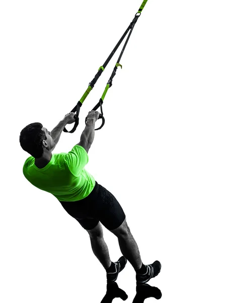 Mann übt Aufhängungstraining trx Silhouette — Stockfoto