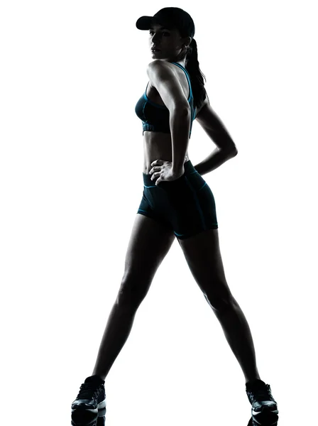 Kadın atlet jogger germe siluet — Stok fotoğraf