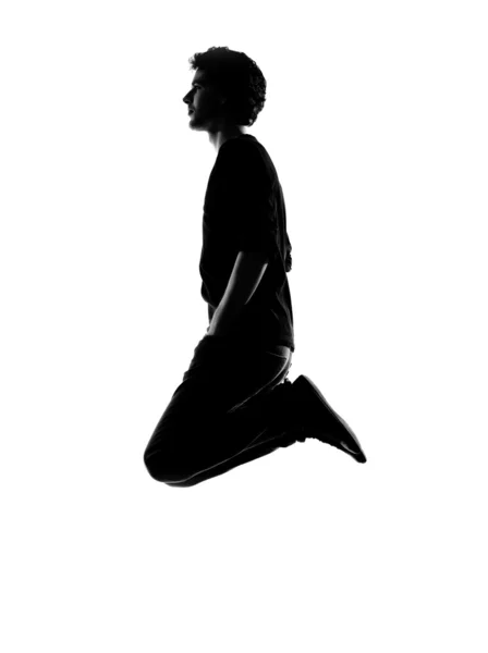 Jovem homem engraçado saltando silhueta — Fotografia de Stock