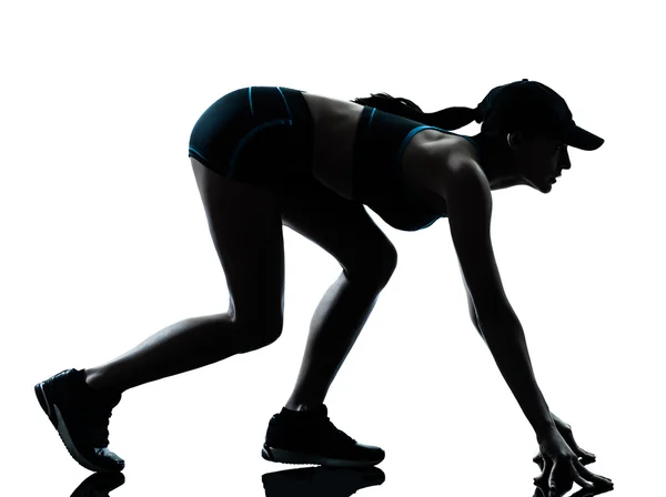 Woman runner jogger on the starting block silhouette — Stock Photo, Image