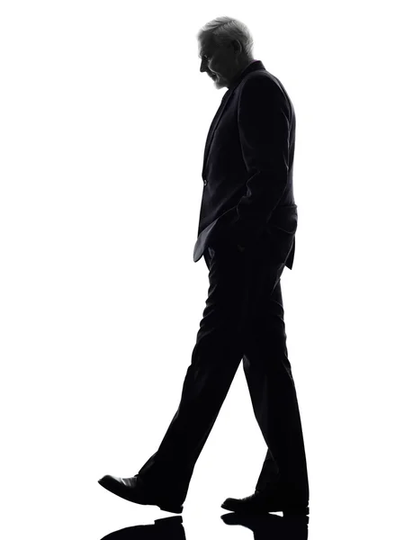 Senior business man walking silhouette — Stock Photo, Image