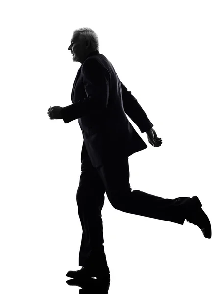 Senior business man running silhouette — Stock Photo, Image