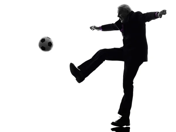 Senior uomo d'affari giocare a calcio silhouette — Foto Stock