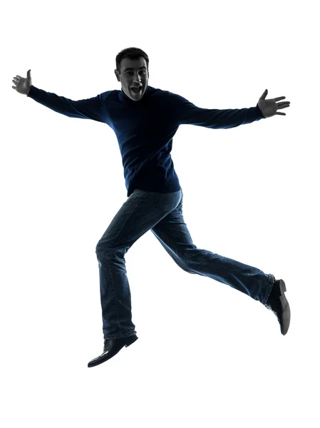 Ember boldog jumping tisztelegve silhouette teljes hossza — Stock Fotó