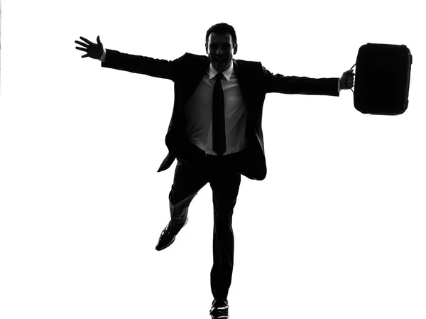 Business man loopt Gelukkig armen gestrekt silhouet — Stockfoto