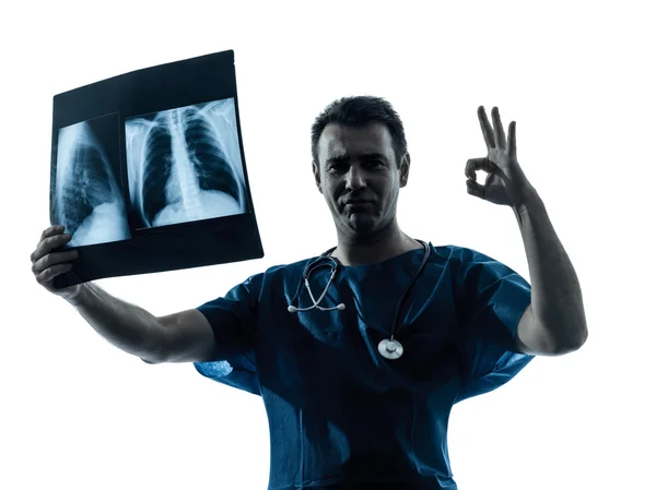 Doctor surgeon radiologist gesturing okay examining lung torso — Stock Photo, Image