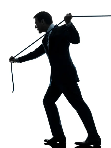 Business man pulling a rope silhouette — Stock Photo, Image