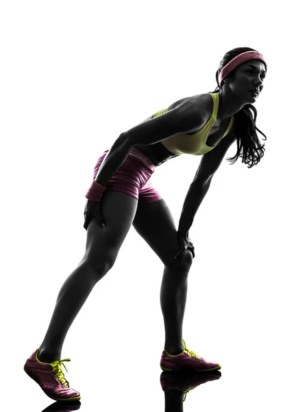 Mulher corredor correndo dor muscular cãibra silhueta — Fotografia de Stock