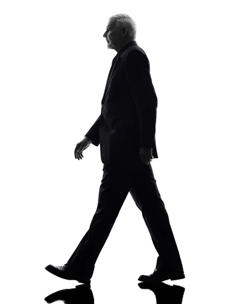 Senior business man walking silhouette — Stock Photo, Image