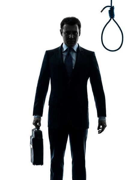 business man in front of  hangman noose silhouette