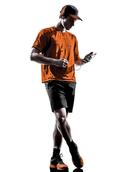 男人跑慢跑智能手机耳机剪影 — 图库照片