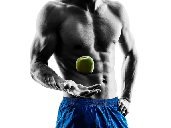 Hombre ejercitando ejercicios de fitness comiendo silueta de manzana —  Fotos de Stock