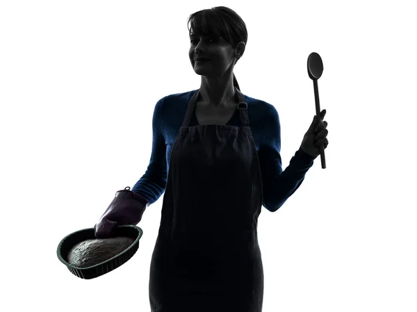 Mulher cozinhando bolo silhueta pastelaria — Fotografia de Stock