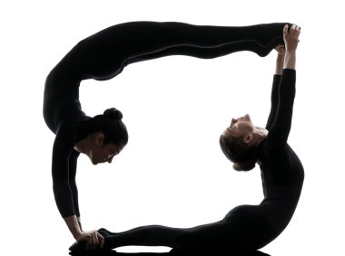 two women contortionist  exercising gymnastic yoga silhouette clipart