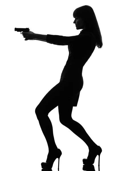 Sexy detective  woman holding aiming  gun silhouette — Stock Photo, Image