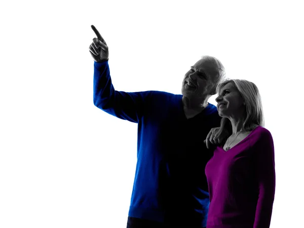 Couple senior happy pointing silhouette — Stock Photo, Image