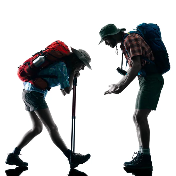 Couple trekker trekking tired silhouette — Stock Photo, Image