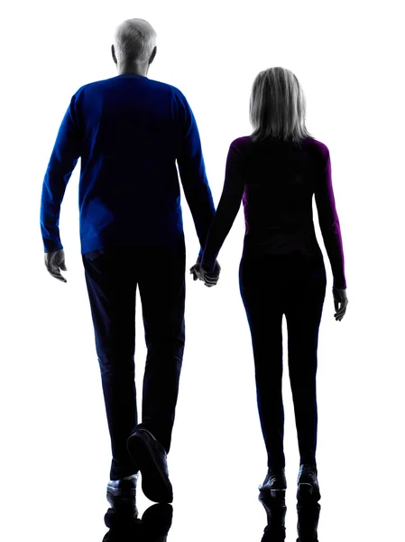 Couple senior walking rear view silhouette — Stock Photo, Image