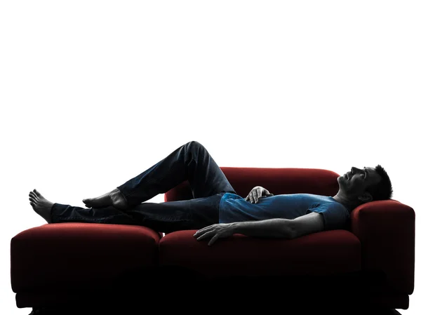 Trener kanapa człowieka leżącego spania — Zdjęcie stockowe