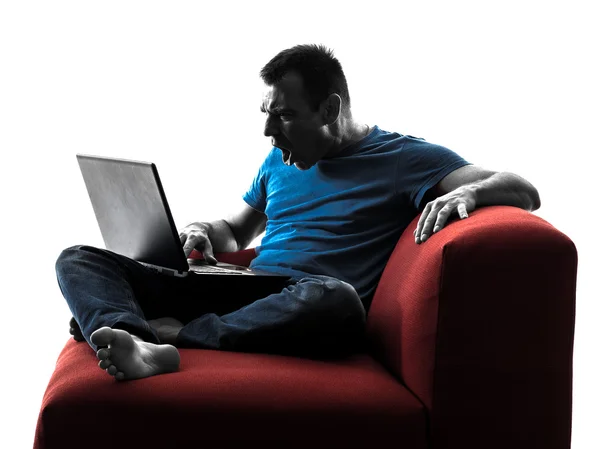 Людина диван диван комп'ютерні обчислювальні ноутбуки — стокове фото