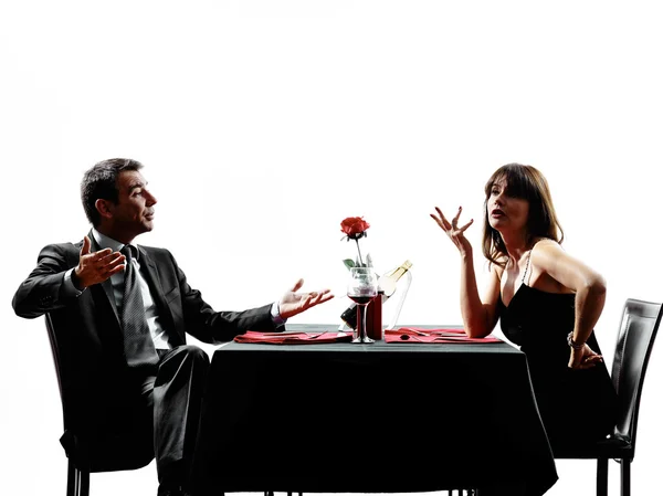 Couples lovers dating dinner dispute silhouettes — Stock Photo, Image