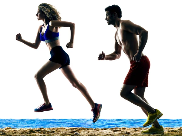 Couple runners running on the beach — Stock Photo, Image