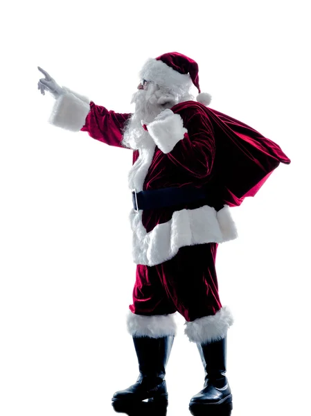 Santa claus wyświetlone wskazującego sylwetka na białym tle — Zdjęcie stockowe
