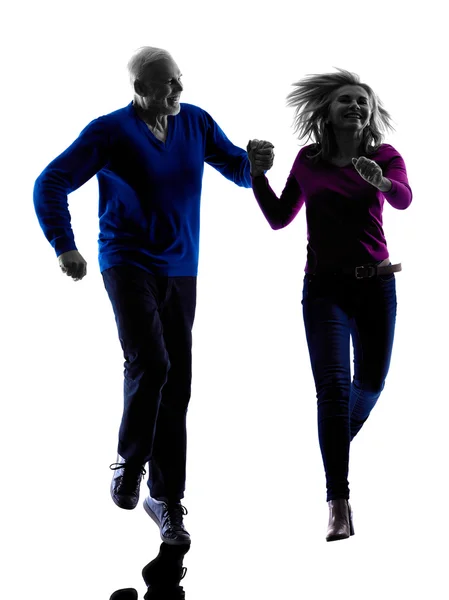 Couple senior running jumping happy  silhouette — Stock Photo, Image