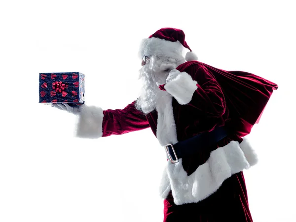 Santa claus att ge gåvor silhouette isolerade — Stockfoto