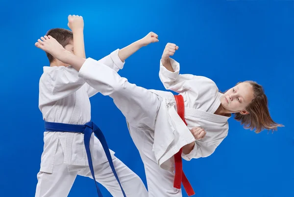 A circular punch and block are training boy and girl — Stock Photo, Image