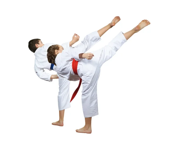 Girl and boy are hitting a high kick leg — Stock Photo, Image