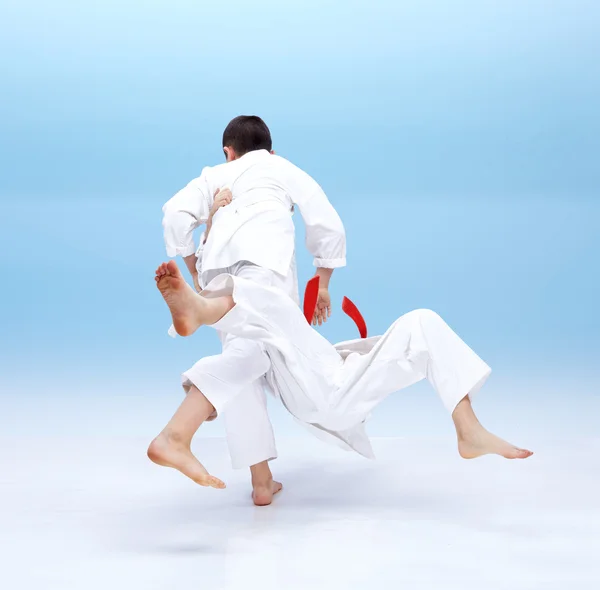 With white belt boy is doing throw — Stock Photo, Image