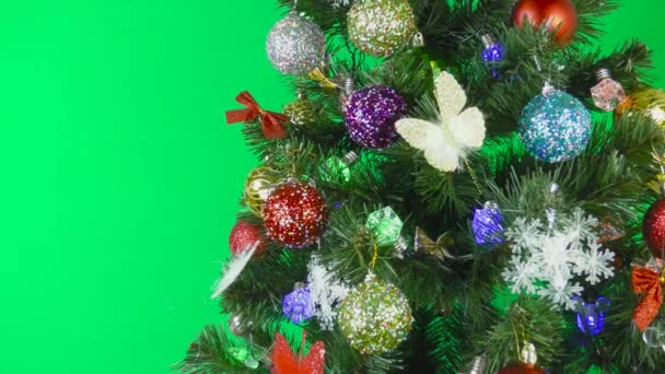 Juletre Dekorert Med Blinkende Perler Pærer Grønn Bakgrunn – stockvideo