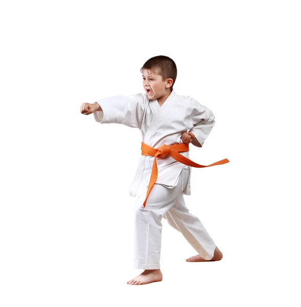 Recta golpe brazo un golpeando pequeño deportista en karategi — Foto de Stock