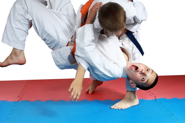 Sportsman with a blue belt doing judo throw — Stock Photo, Image