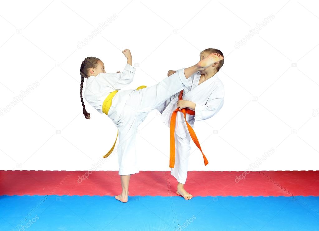 Girl is the beating boy on the head with a circular kick leg