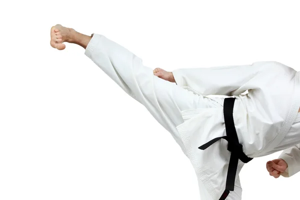 Man in karategi beats blow leg — Stock Photo, Image