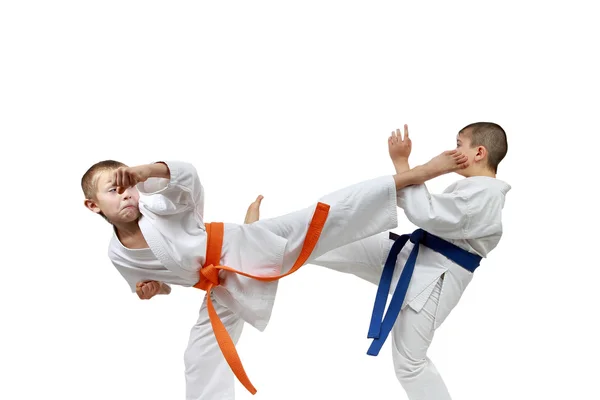 Blows kicking sportsmens are beating to meet each other — Stock Photo, Image