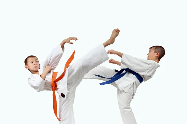 Athletes in karategi are beating karate blows — Stock Photo, Image