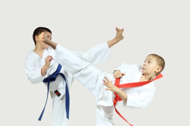 High blows legs are beat sportsmens in karategi clipart