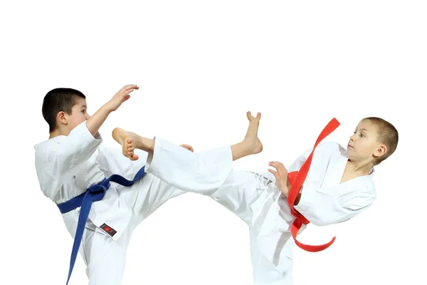 Blows legs are beating athletes with different colored belts — Stock Photo, Image
