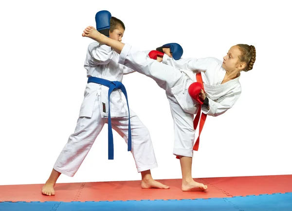 With overlays on the hands two athletes are training kick leg and protection — Stock Photo, Image