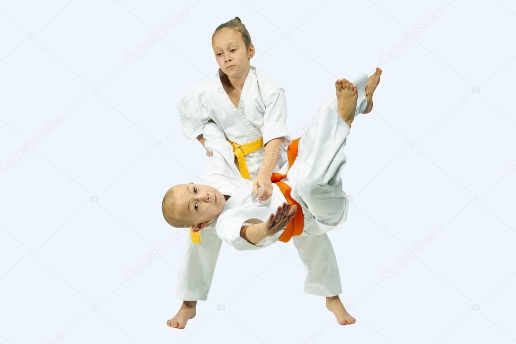 Two children performs judo throws