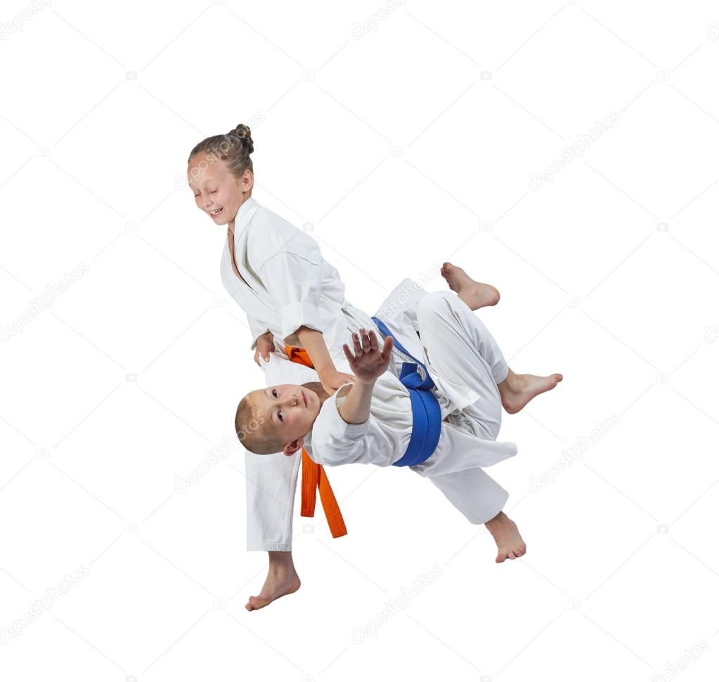 With orange belt girl is doing judo throw