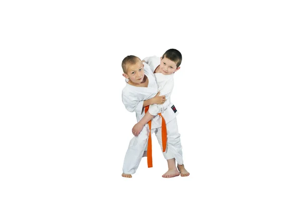 An athlete with an orange belt makes a grab for the throw — Stock Photo, Image