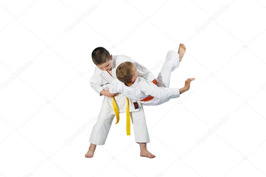 Children are doing high throws judo in judogi