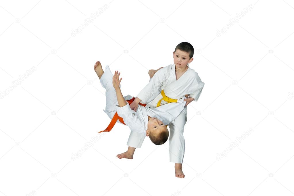 Two athletes perform judo throws