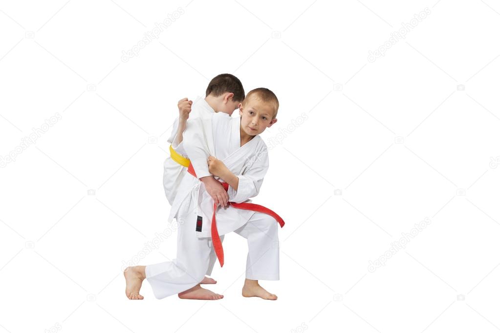 With a red belt sportsman makes a grab for the throw